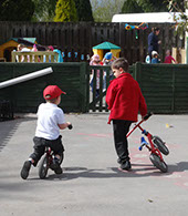photo showing two boys playing with bikes at Longscroft