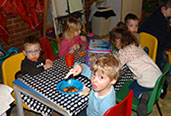 photo showing children sitting down to eat in Ladybirds, Longscroft