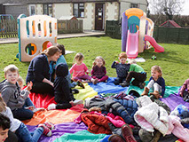 photo showing children at Longscroft playing outside