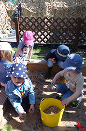 photo showing children playing in the sandpit at Longscroft