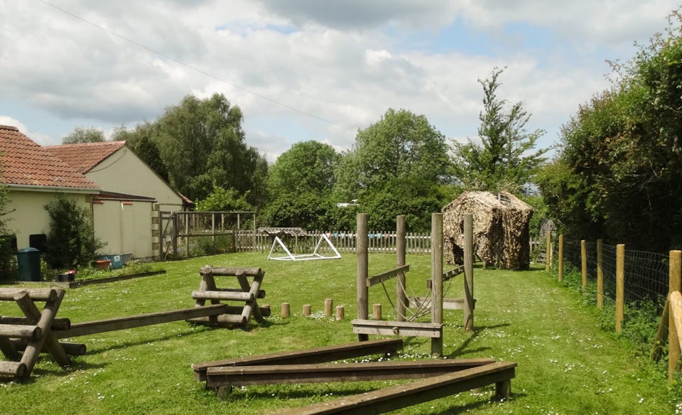 Photo of outdoor playing field at Longscroft Nursery