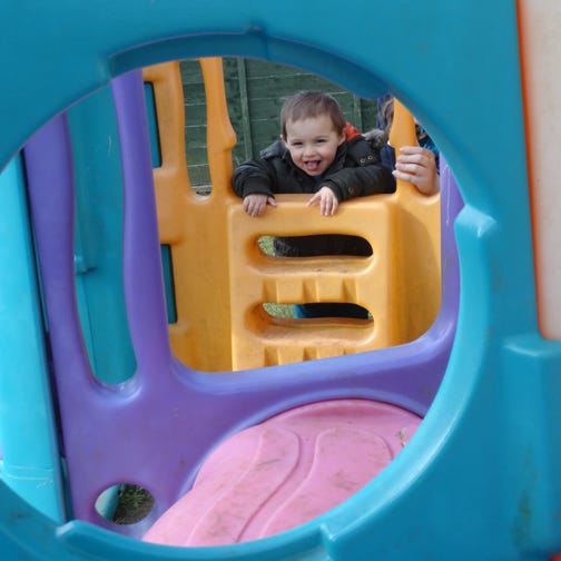 Photo of baby boys playing in garden at Longscroft Nursery