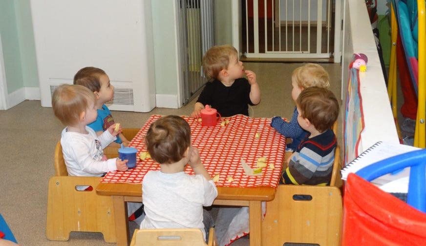 Photo of babies eating together in Bumble Bees at Longscroft Nursery